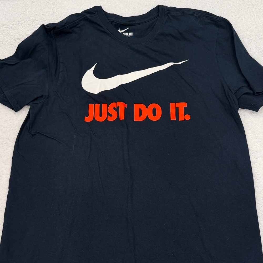 Nike Black Tee with White Swoosh and Orange Text